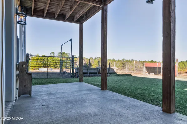 a view of outdoor space with sign board and yard