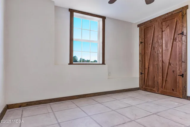 a view of a house with a yard and garage