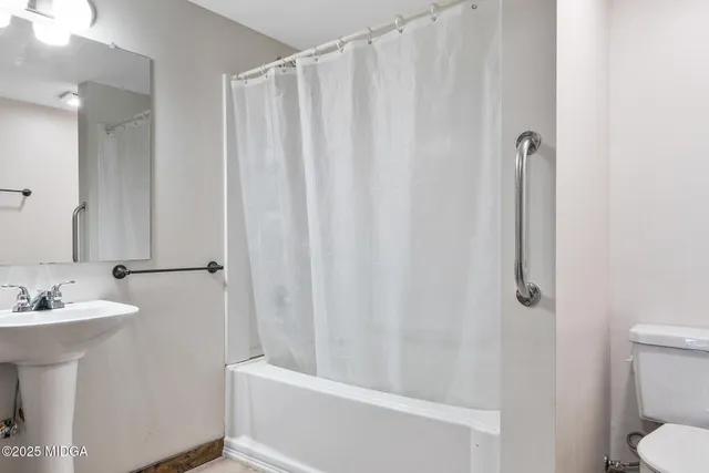 a view of outdoor space with sign board and yard