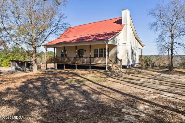 a house with trees in front of it