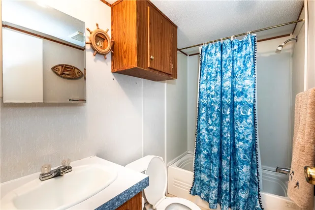 a swimming pool with some trees in the background