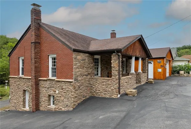 a view of a house with large windows