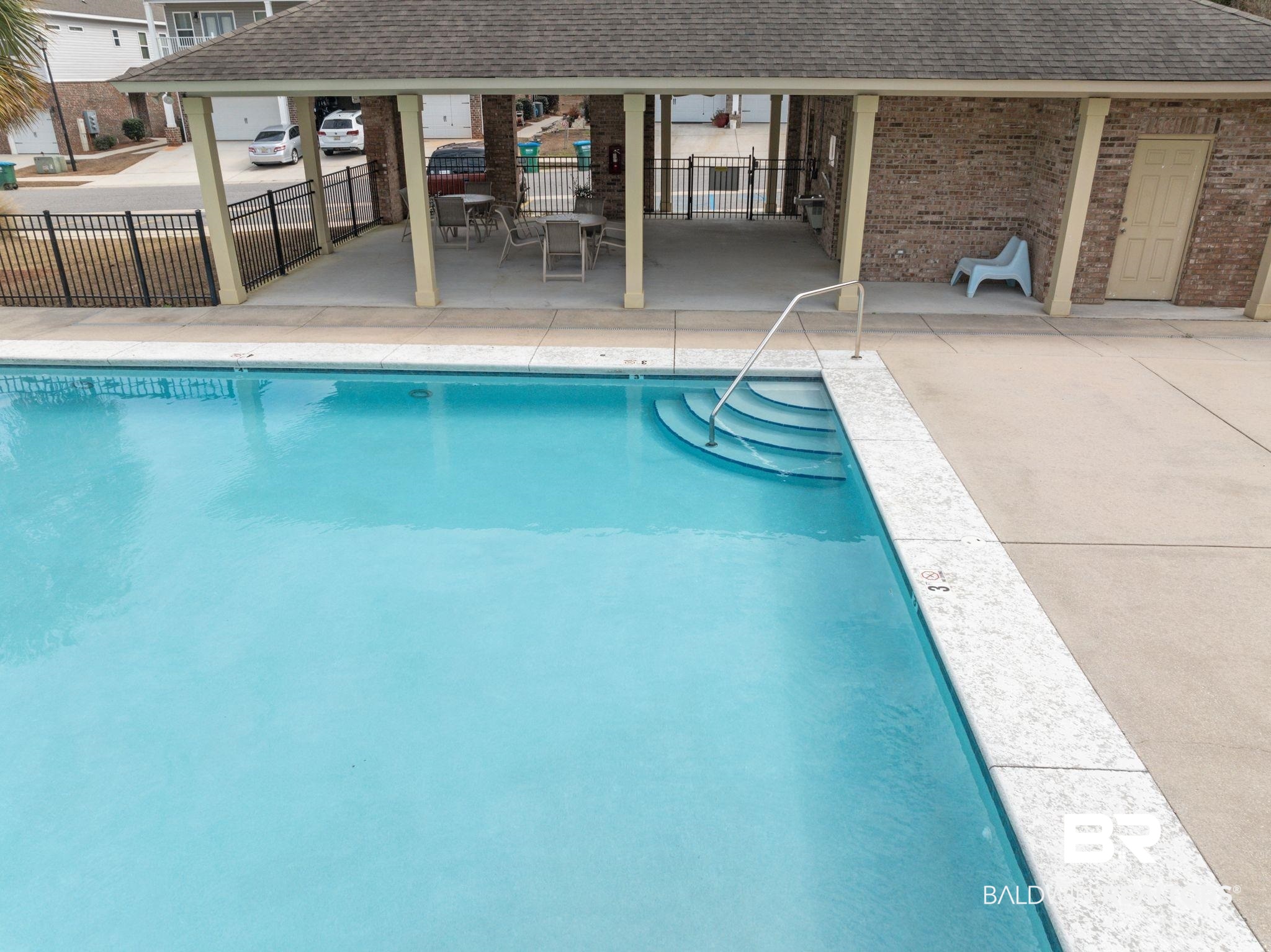 6903 Spaniel Drive, Unit B Spanish Fort, AL 36527 - Photo 25 of 28 View of swimming pool with a patio area and fence