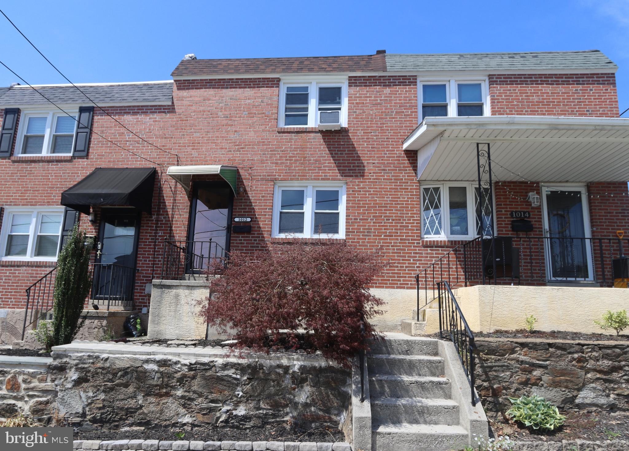 1012 Wells Street Conshohocken, PA 19428 - Photo 1 of 29 a front view of a house with garden