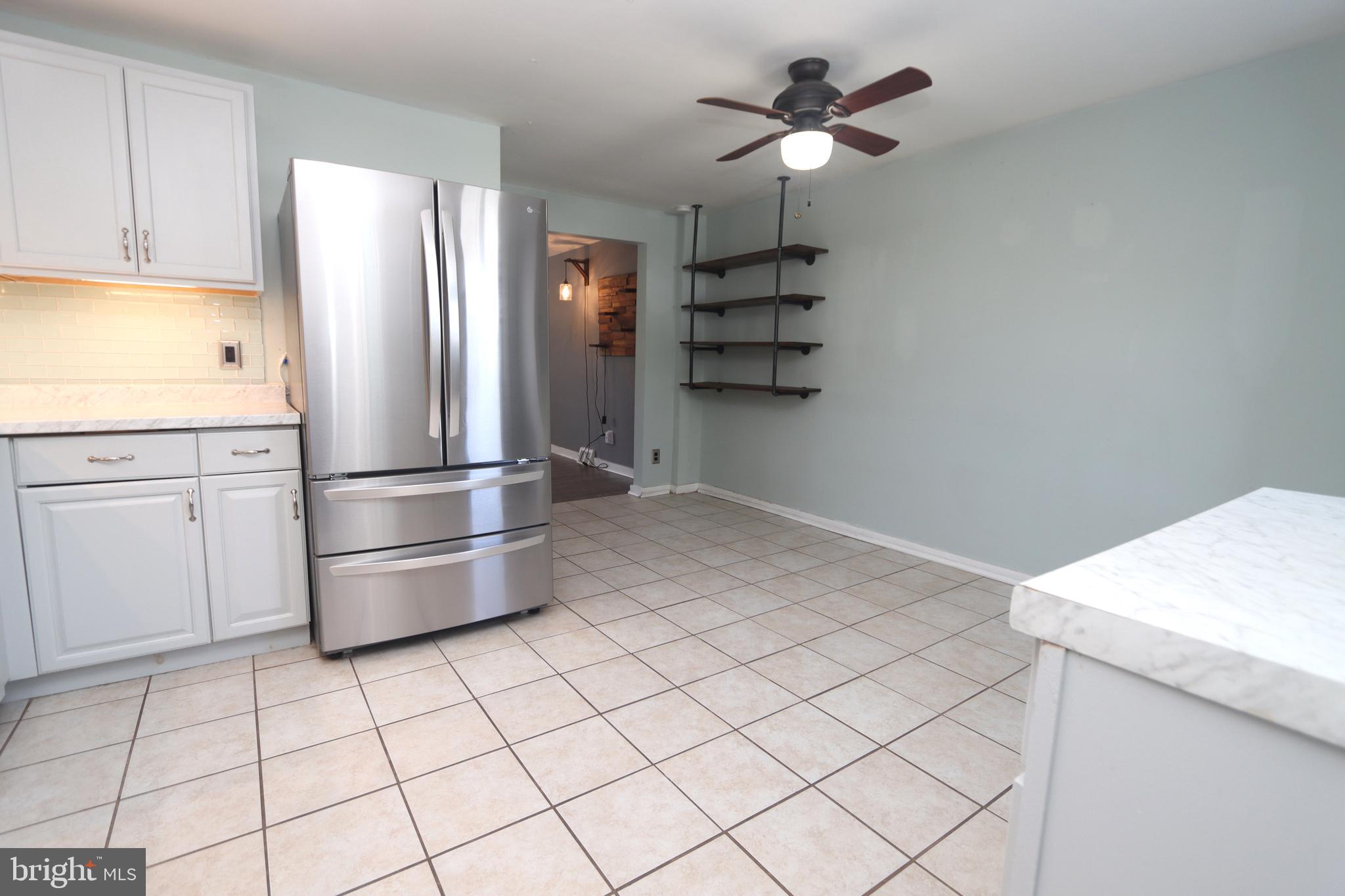 1012 Wells Street Conshohocken, PA 19428 - Photo 11 of 29 a kitchen with stainless steel appliances a refrigerator and cabinets