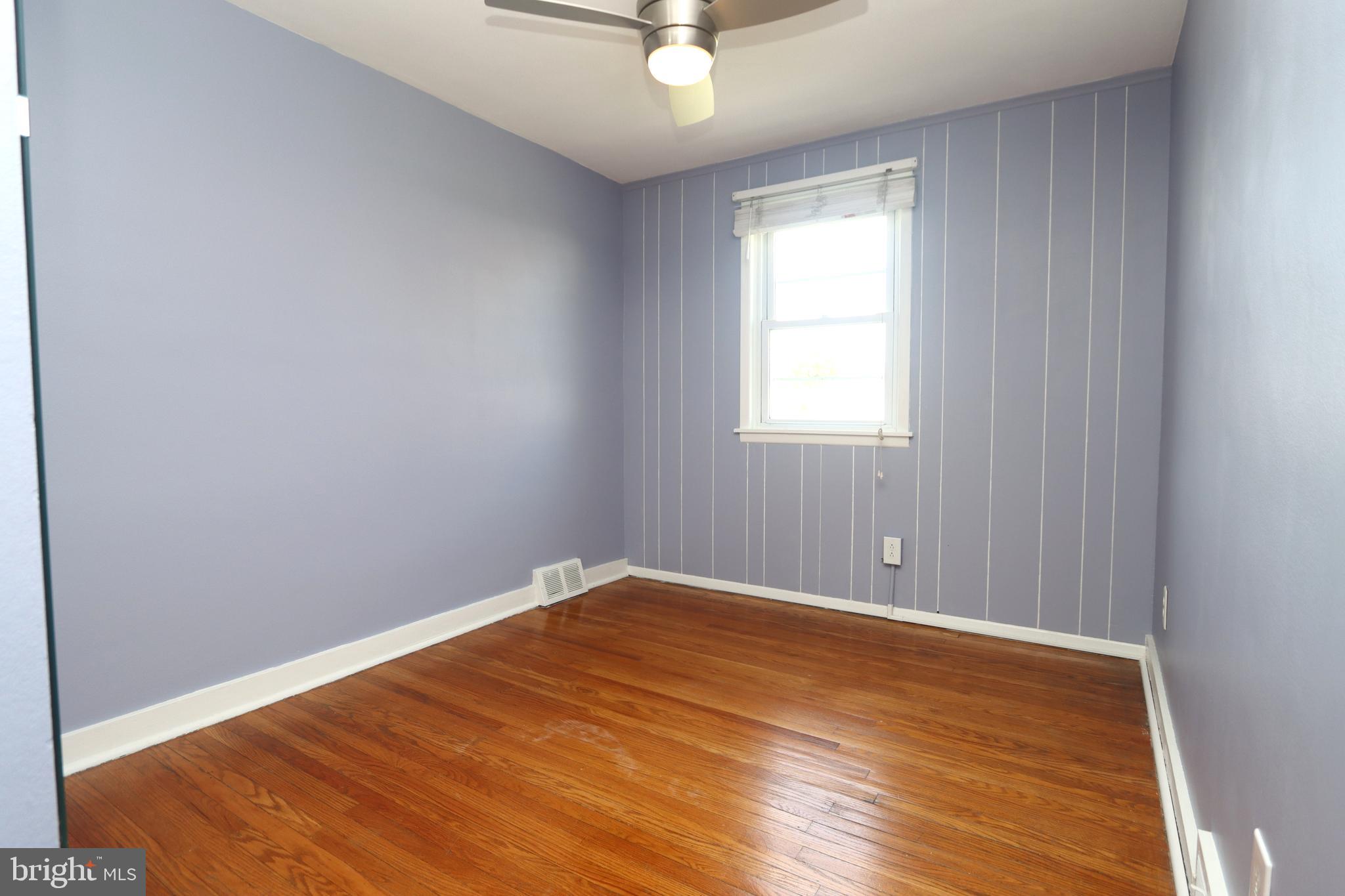 1012 Wells Street Conshohocken, PA 19428 - Photo 19 of 29 an empty room with a window and a ceiling fan