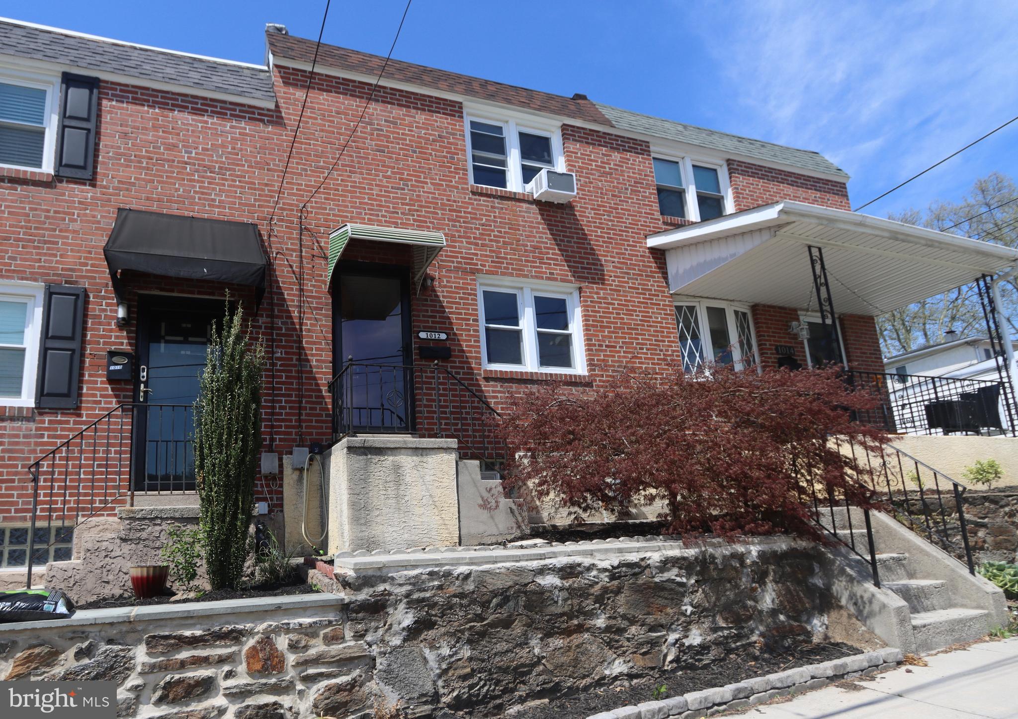 1012 Wells Street Conshohocken, PA 19428 - Photo 2 of 29 a front view of a house with garden