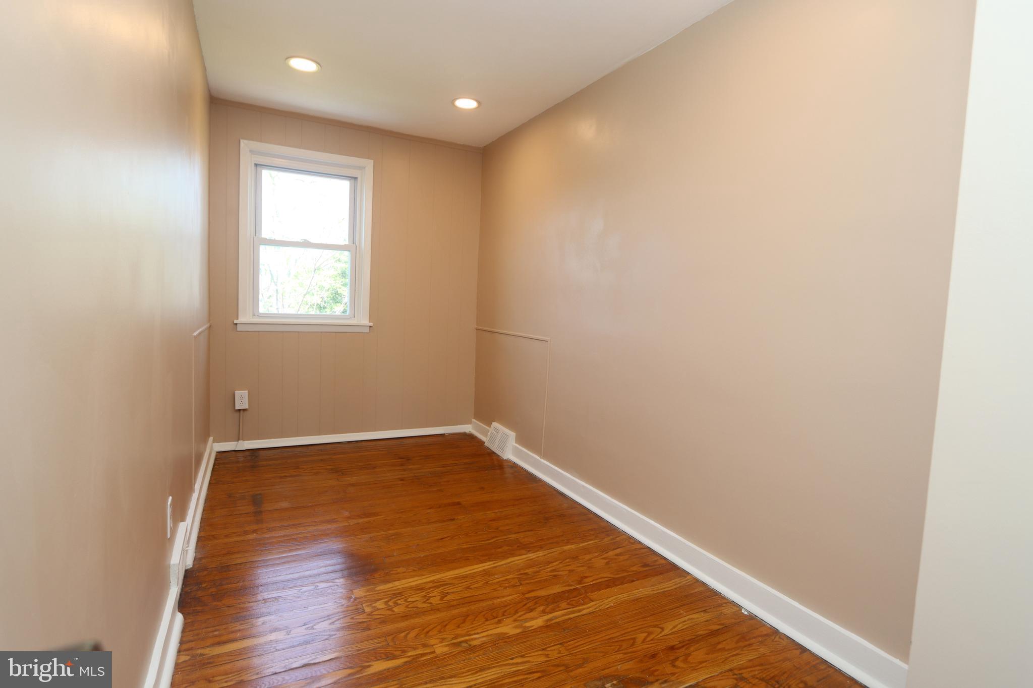 1012 Wells Street Conshohocken, PA 19428 - Photo 22 of 29 an empty room with wooden floor and windows
