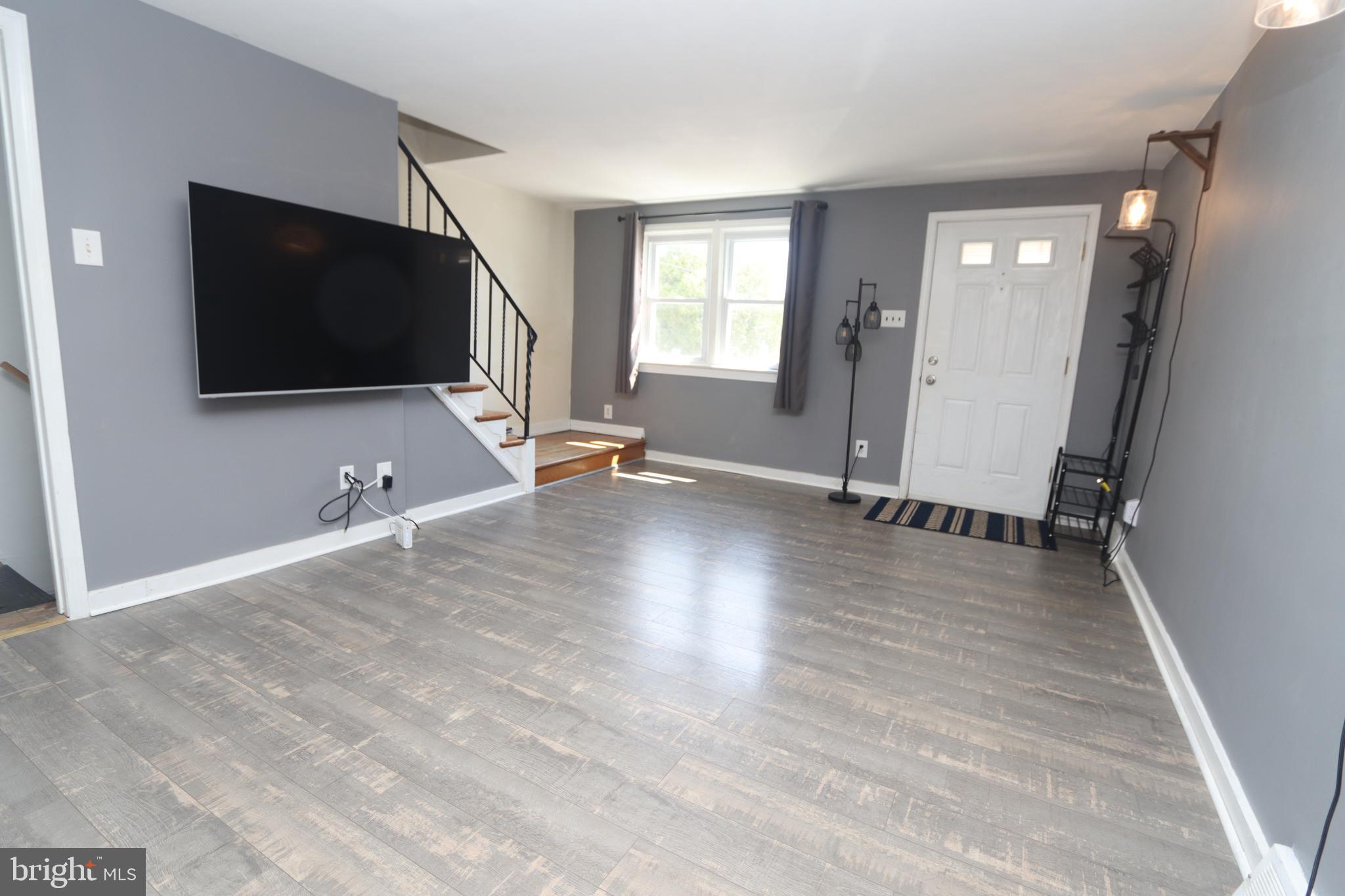 1012 Wells Street Conshohocken, PA 19428 - Photo 4 of 29 a view of a livingroom with wooden floor and a flat screen tv