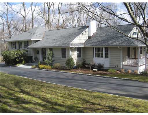 58 Stanton Road Darien, CT 06820 - Photo 1 of 17 a front view of a house with garden