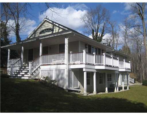 58 Stanton Road Darien, CT 06820 - Photo 2 of 17 a front view of a house with a yard