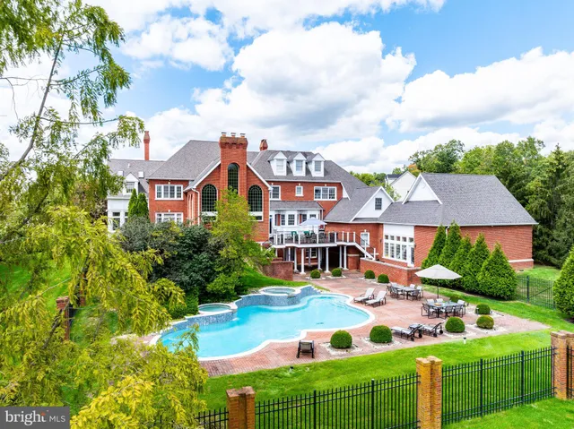 an aerial view of multiple houses with yard