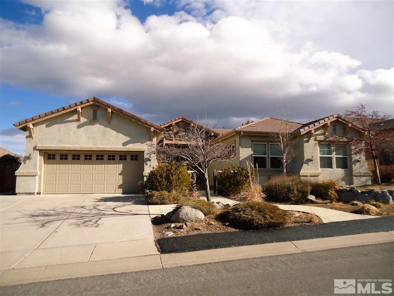 529 Spirit Ridge Court Reno, NV 89511 - Photo 1 of 1 a front view of a house with a garden