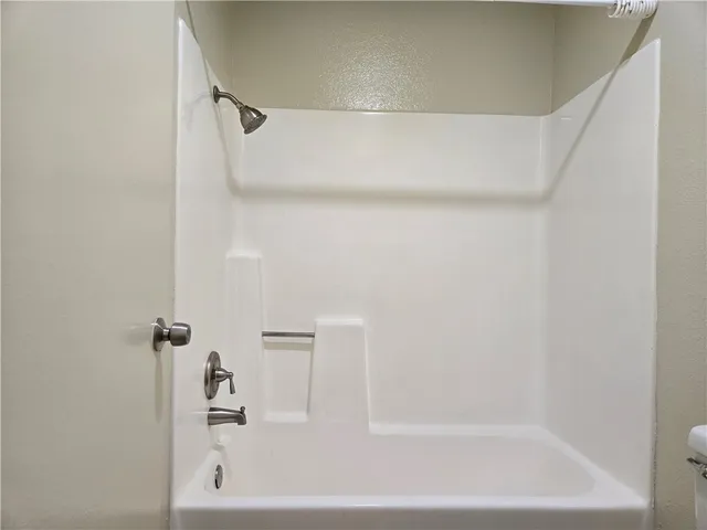 a close view of a bathtub in bathroom
