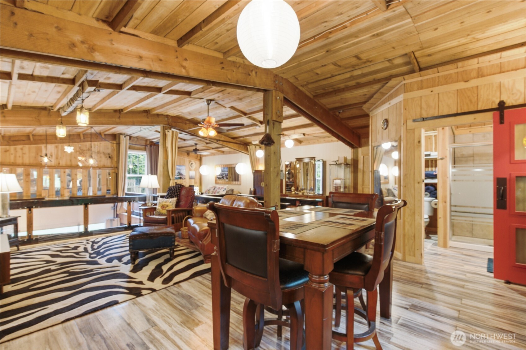3320 Duckabush Road Brinnon, WA 98320 - Photo 14 of 38 a view of a dining room with furniture window and wooden floor