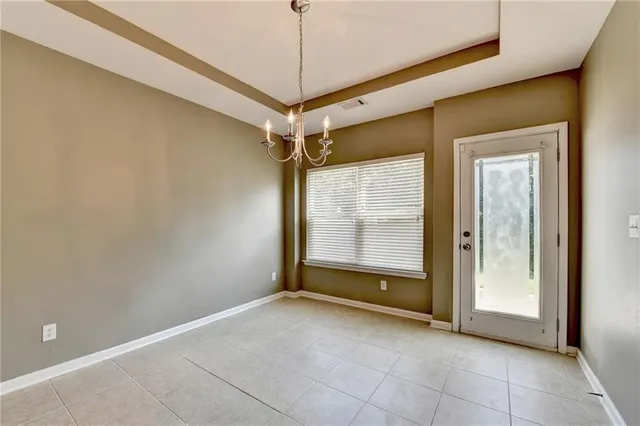 a view of an empty room with a fireplace