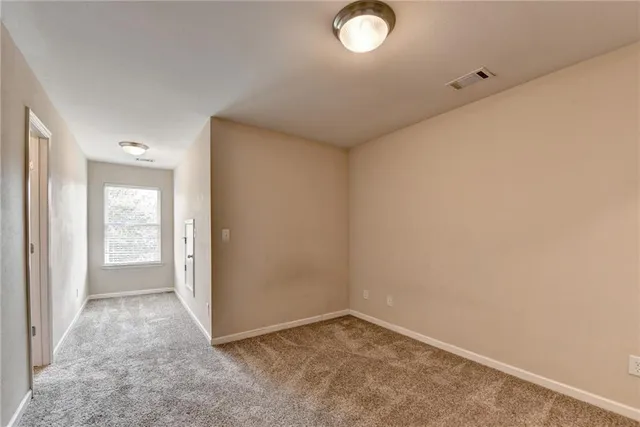 an empty room with closet area