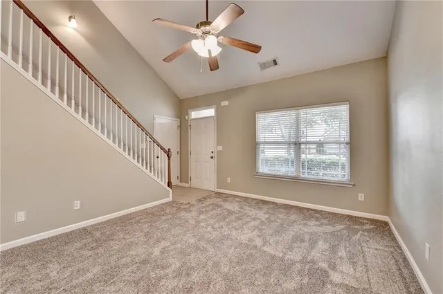 a view of an empty room with a window