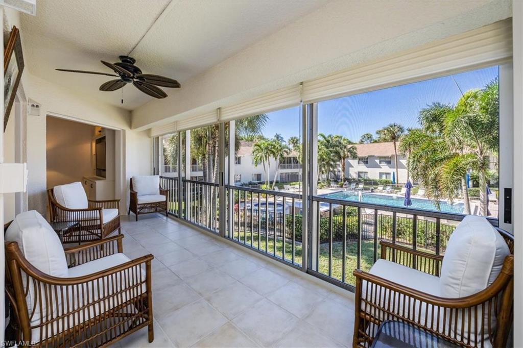 3200 Binnacle Drive, Unit C4 Naples, FL 34103 - Photo 1 of 24 Sunroom / solarium with ceiling fan