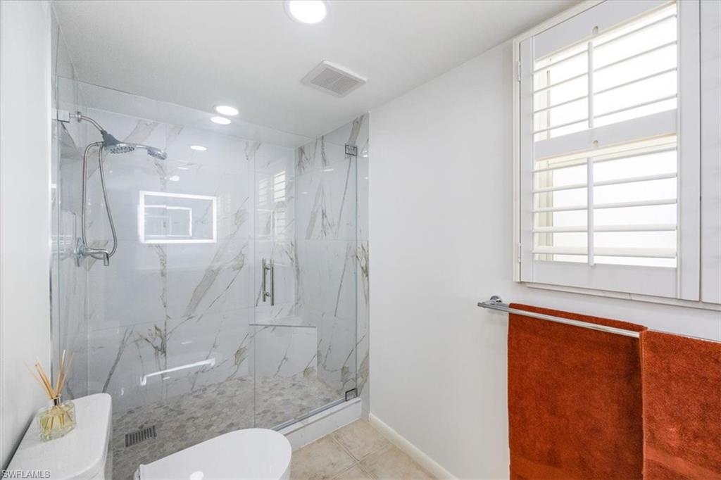 3200 Binnacle Drive, Unit C4 Naples, FL 34103 - Photo 15 of 24 Bathroom with baseboards, visible vents, a marble finish shower, recessed lighting, and toilet