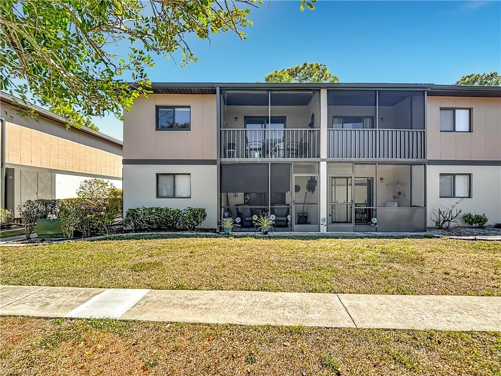 1201 Barrett Road, Unit 1204 North Fort Myers, FL 33903 - Photo 30 of 31 a front view of a house with a yard