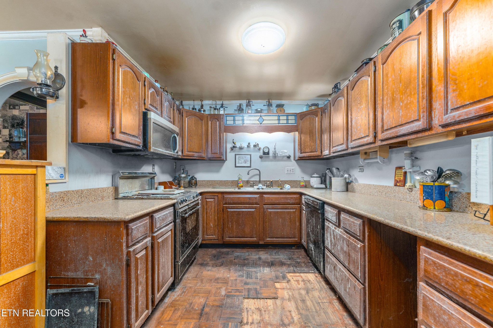 1688 East Wolf Valley Road Heiskell, TN 37754 - Photo 8 of 25 a kitchen with stainless steel appliances granite countertop a sink a stove and cabinets