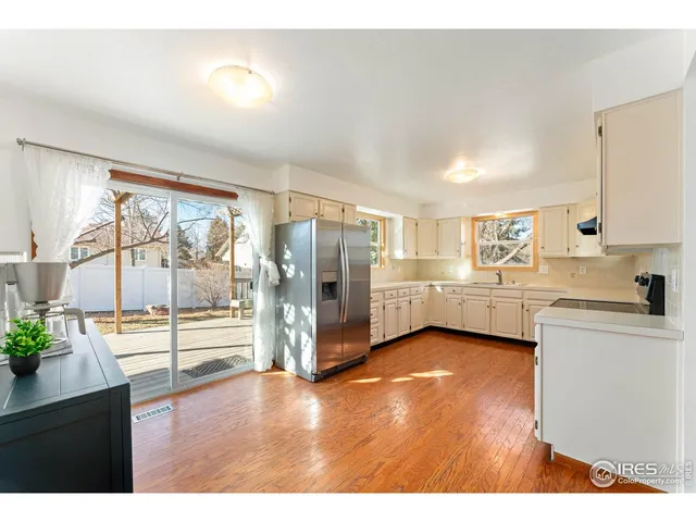 a view of a kitchen with a sink and cabinets