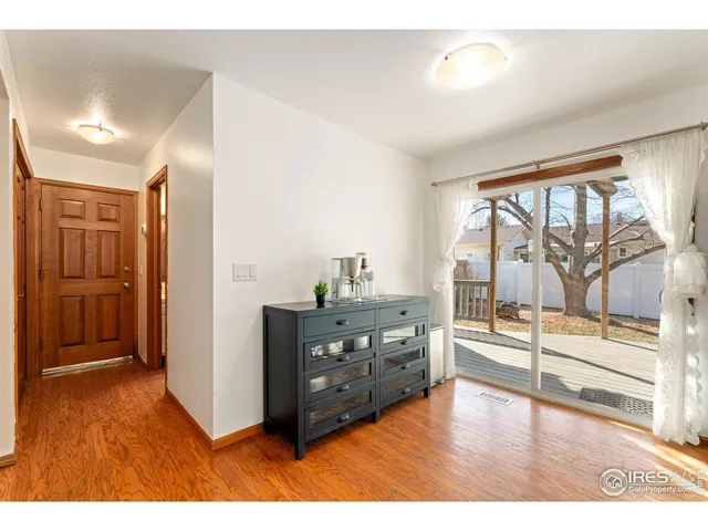 a living room with a dresser