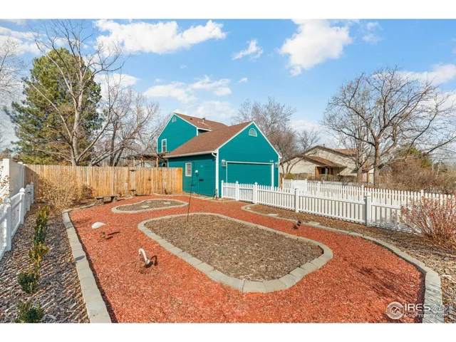 a view of small pool in front of house