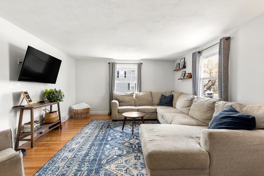 53 Wilson Street Ludlow, MA 01056 - Photo 13 of 26 a living room with furniture and a flat screen tv