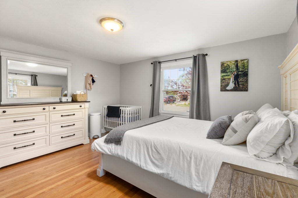 53 Wilson Street Ludlow, MA 01056 - Photo 18 of 26 a bedroom with a bed and a dresser