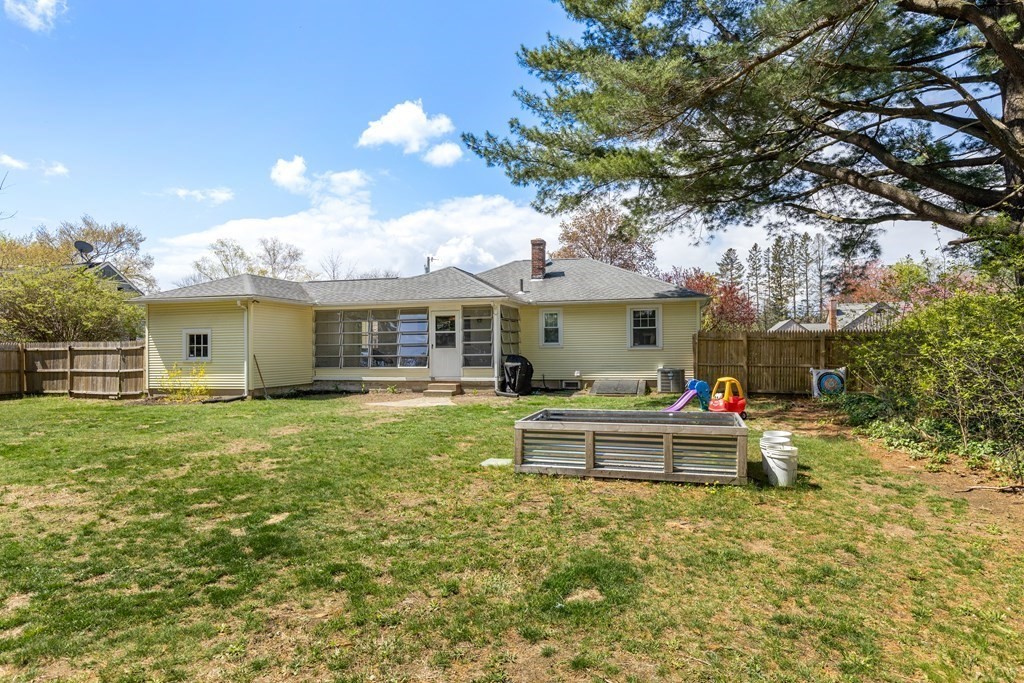 53 Wilson Street Ludlow, MA 01056 - Photo 23 of 26 a front view of a house with a garden and porch