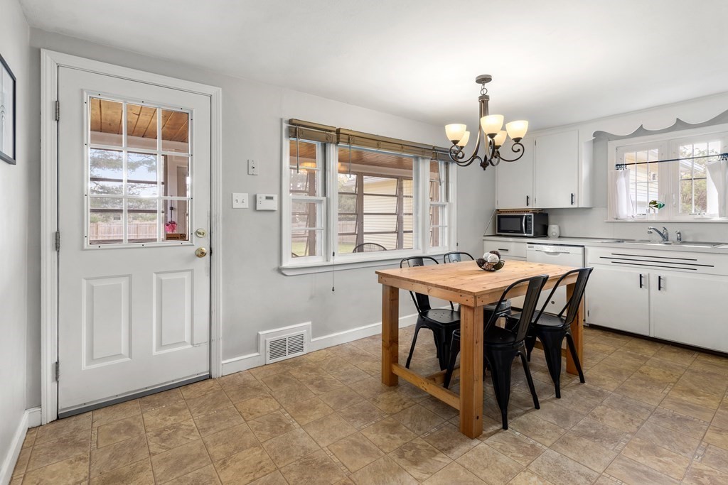 53 Wilson Street Ludlow, MA 01056 - Photo 6 of 26 a view of a dining room with furniture and chandelier