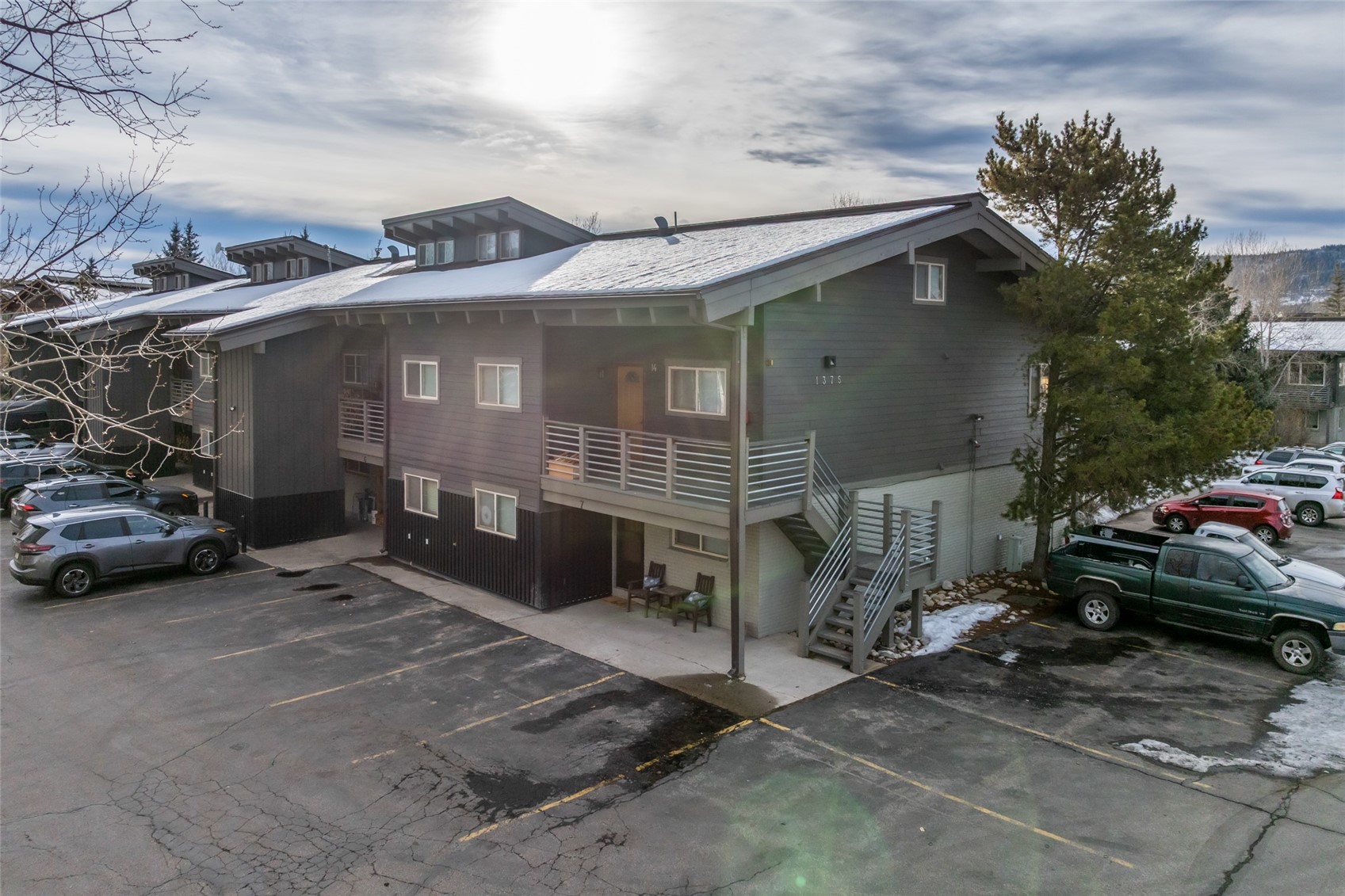 1375 Walton Creek Road, Unit 7 Steamboat Springs, CO 80487 - Photo 2 of 21 a view of a car park in front of house