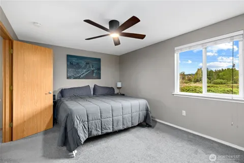 a bedroom with a bed and window