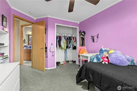 a bedroom with a bed and a couch