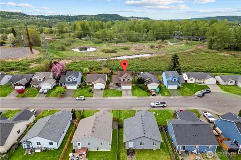 an aerial view of a house with a garden