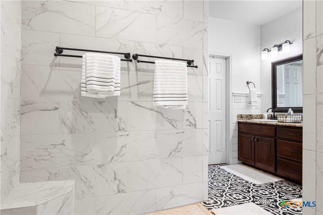 790 Spanish Grant Road Goliad, TX 77963 - Photo 21 of 41 a bathroom with a sink and a mirror