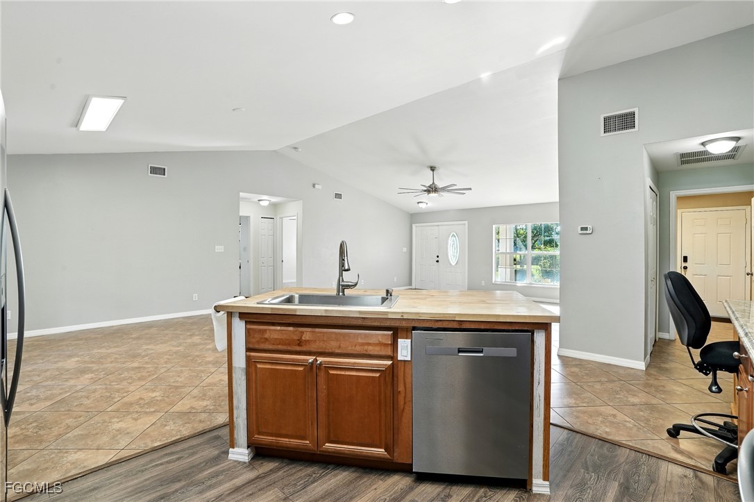2373 Summerall Road LaBelle, FL 33935 - Photo 13 of 47 a room with kitchen island a sink and a stove
