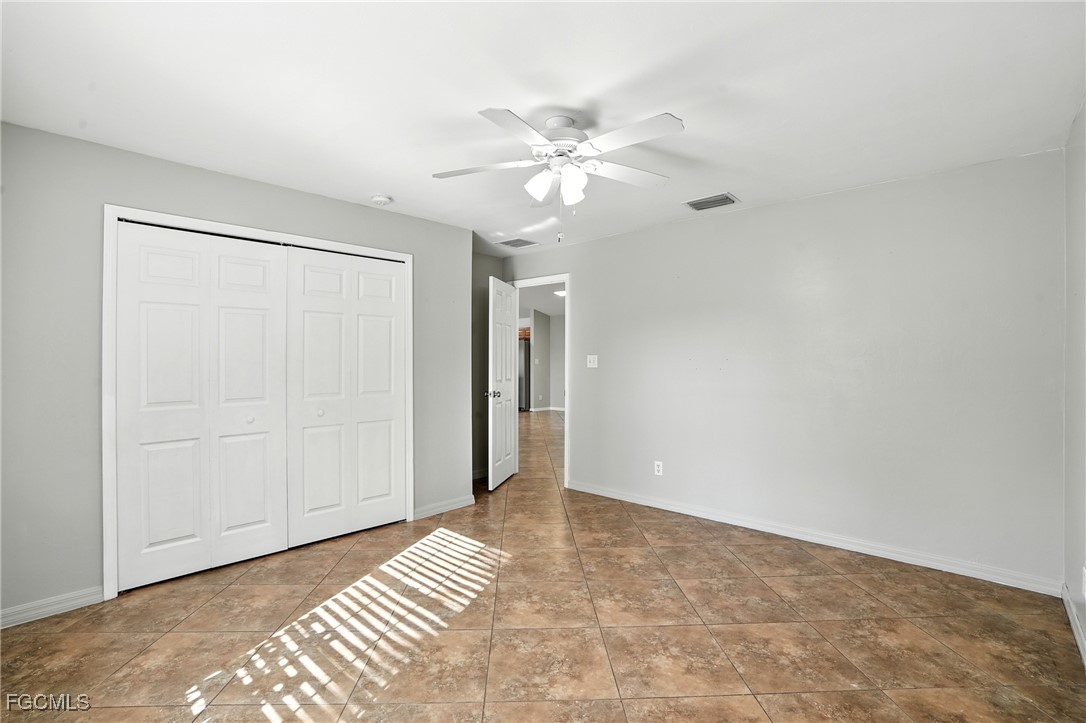 2373 Summerall Road LaBelle, FL 33935 - Photo 22 of 47 a view of an empty room with chandelier fan and closet