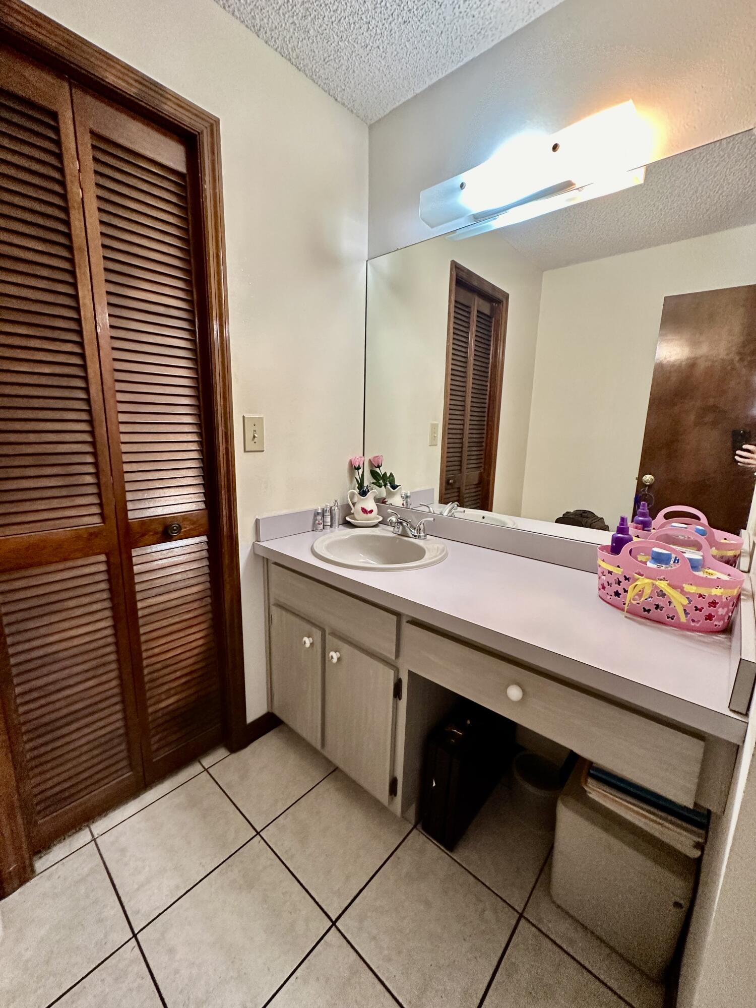 4980 Bridge Road Cocoa, FL 32927 - Photo 17 of 24 a spacious bathroom with a double vanity sink and a mirror