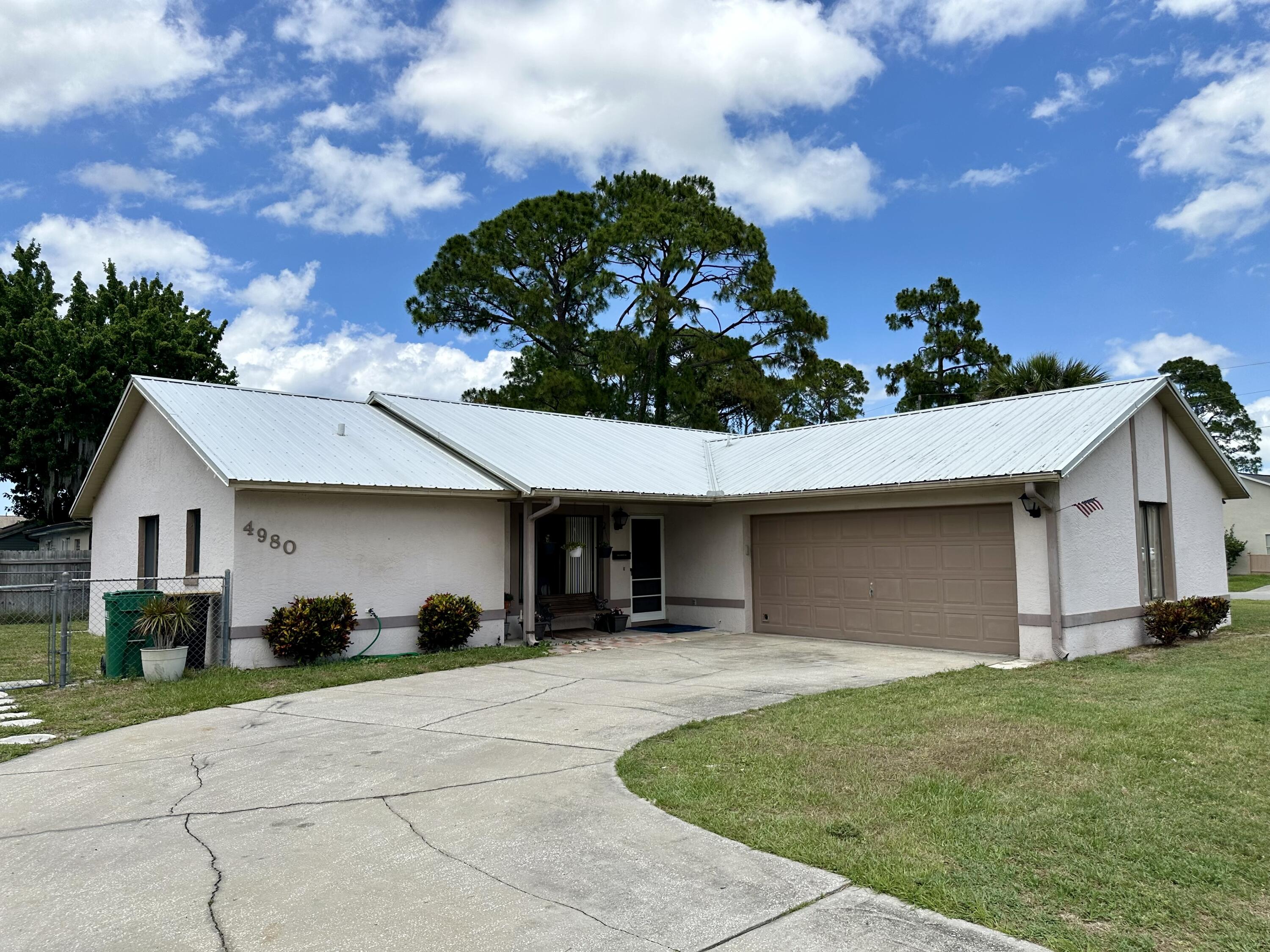 4980 Bridge Road Cocoa, FL 32927 - Photo 2 of 24 a view of a house with backyard and garden