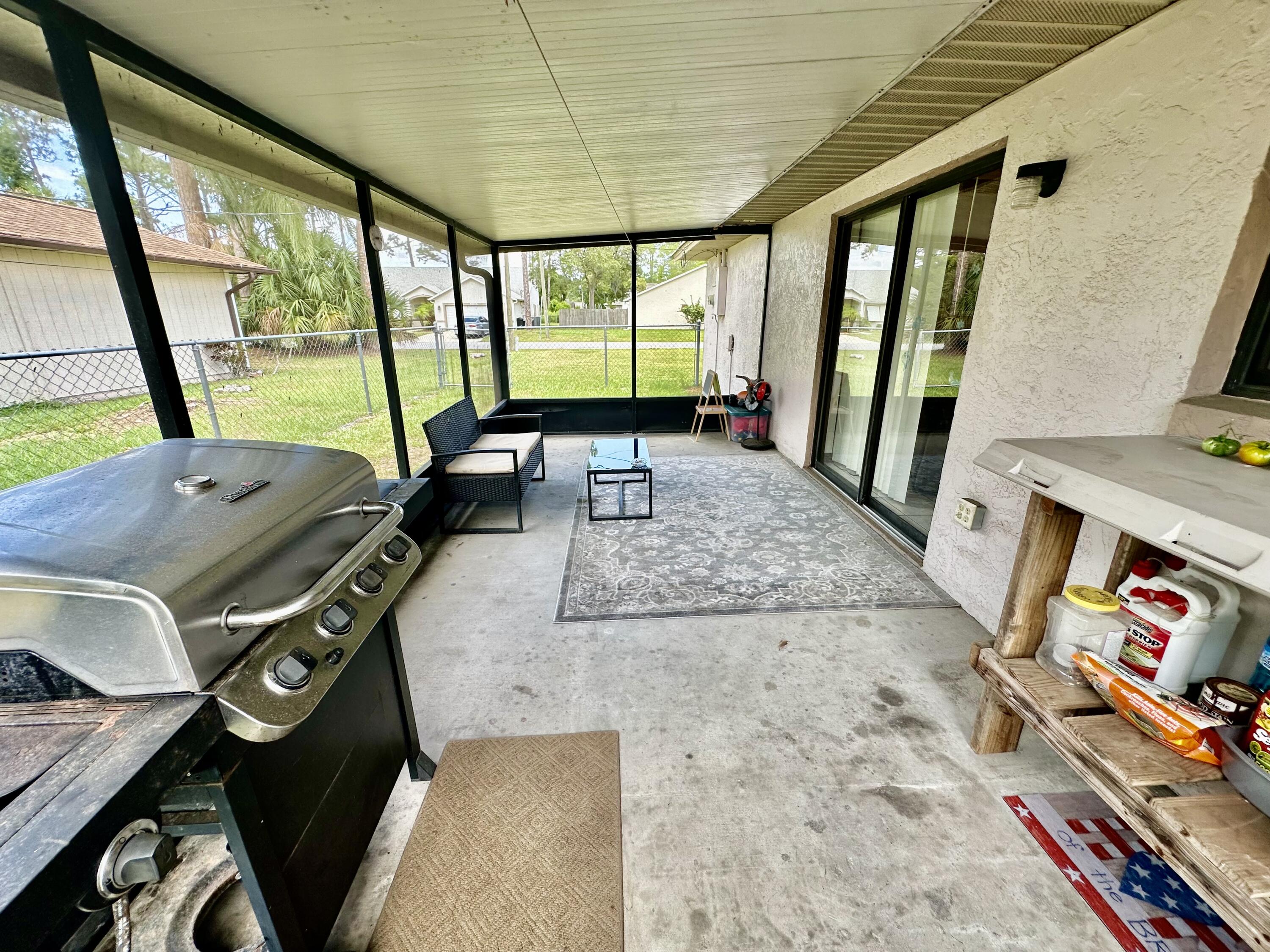 4980 Bridge Road Cocoa, FL 32927 - Photo 21 of 24 a living room with chairs