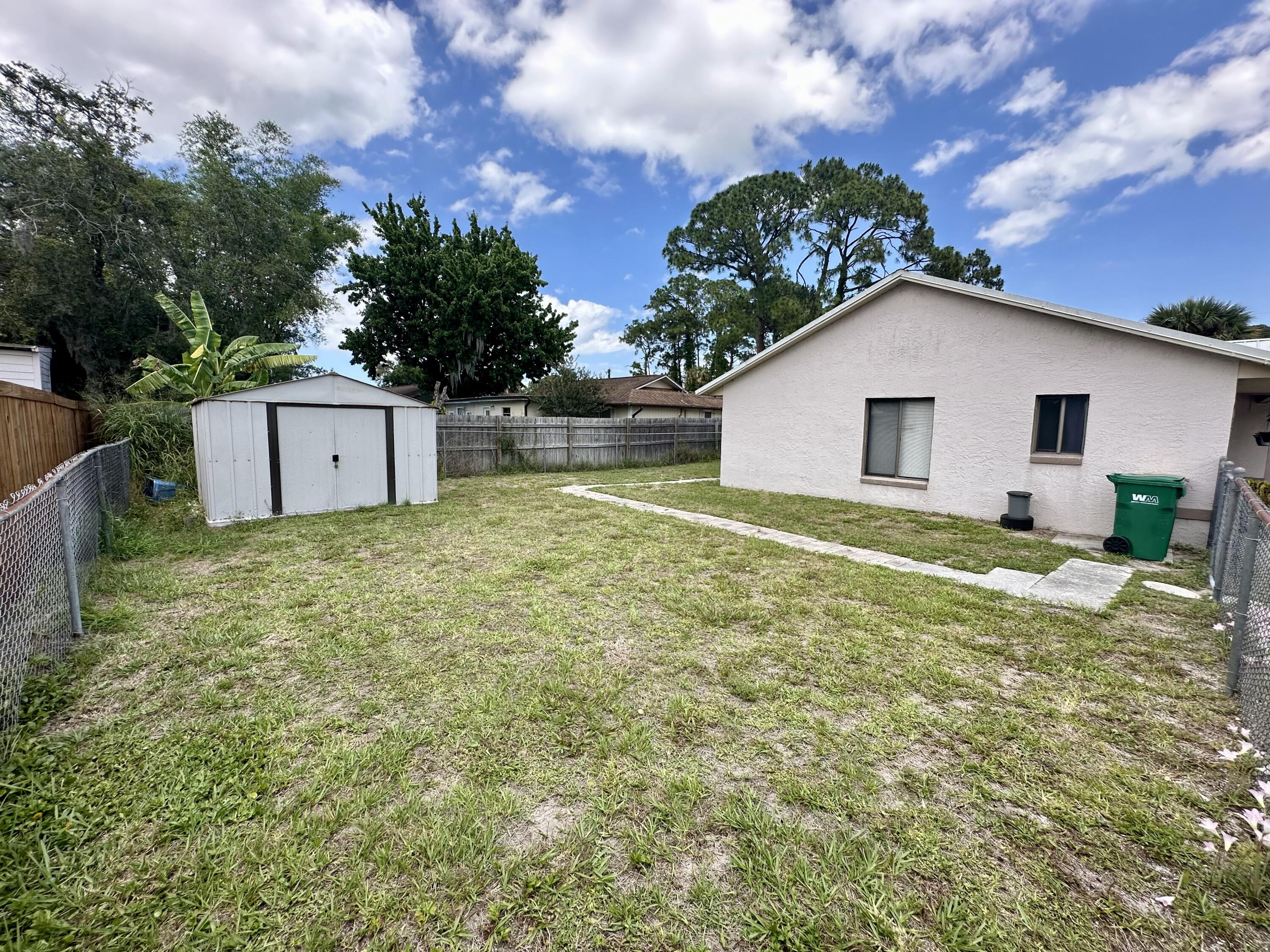 4980 Bridge Road Cocoa, FL 32927 - Photo 5 of 24 a view of a house with a yard
