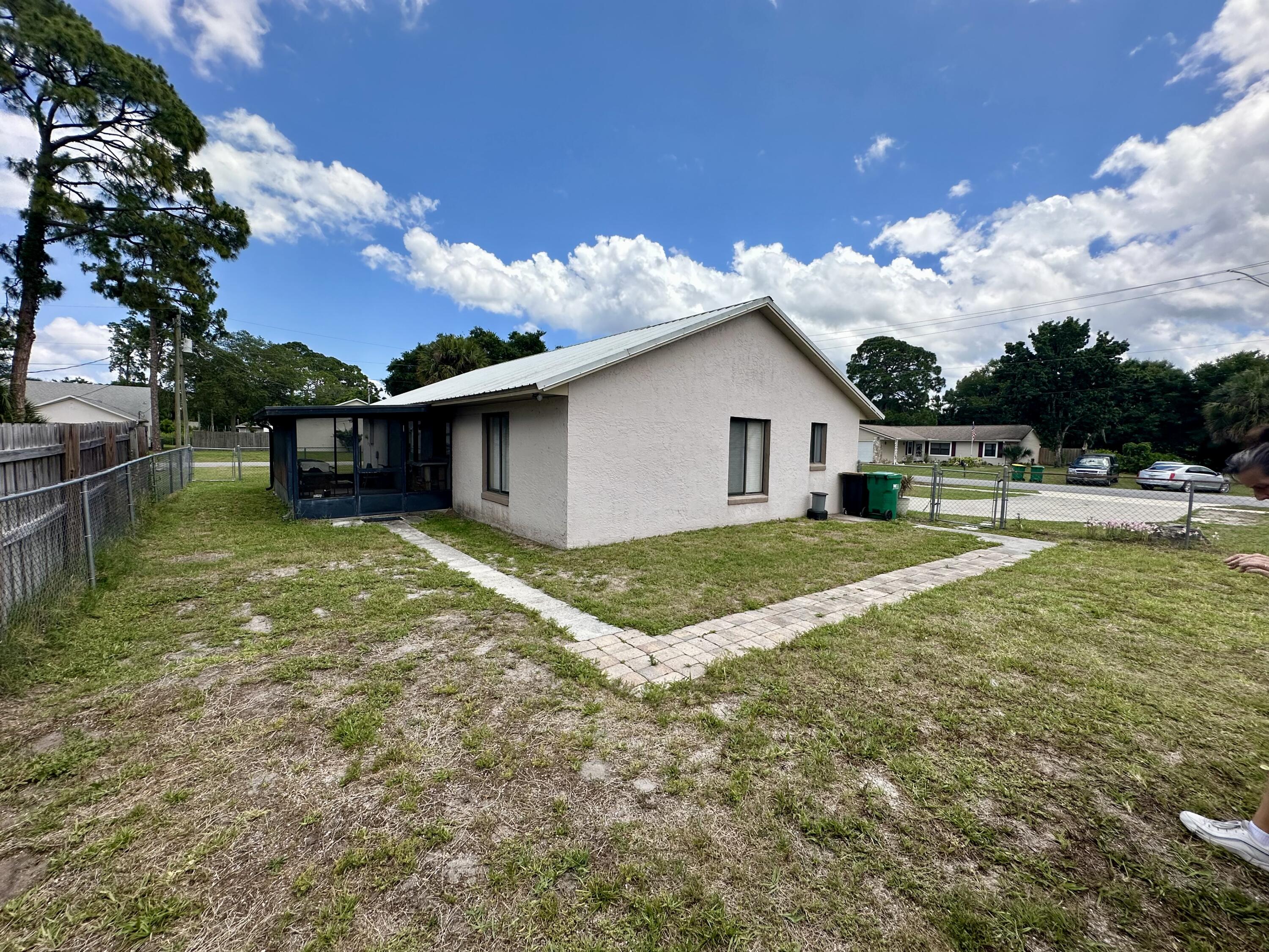 4980 Bridge Road Cocoa, FL 32927 - Photo 6 of 24 a view of a house with pool and chairs