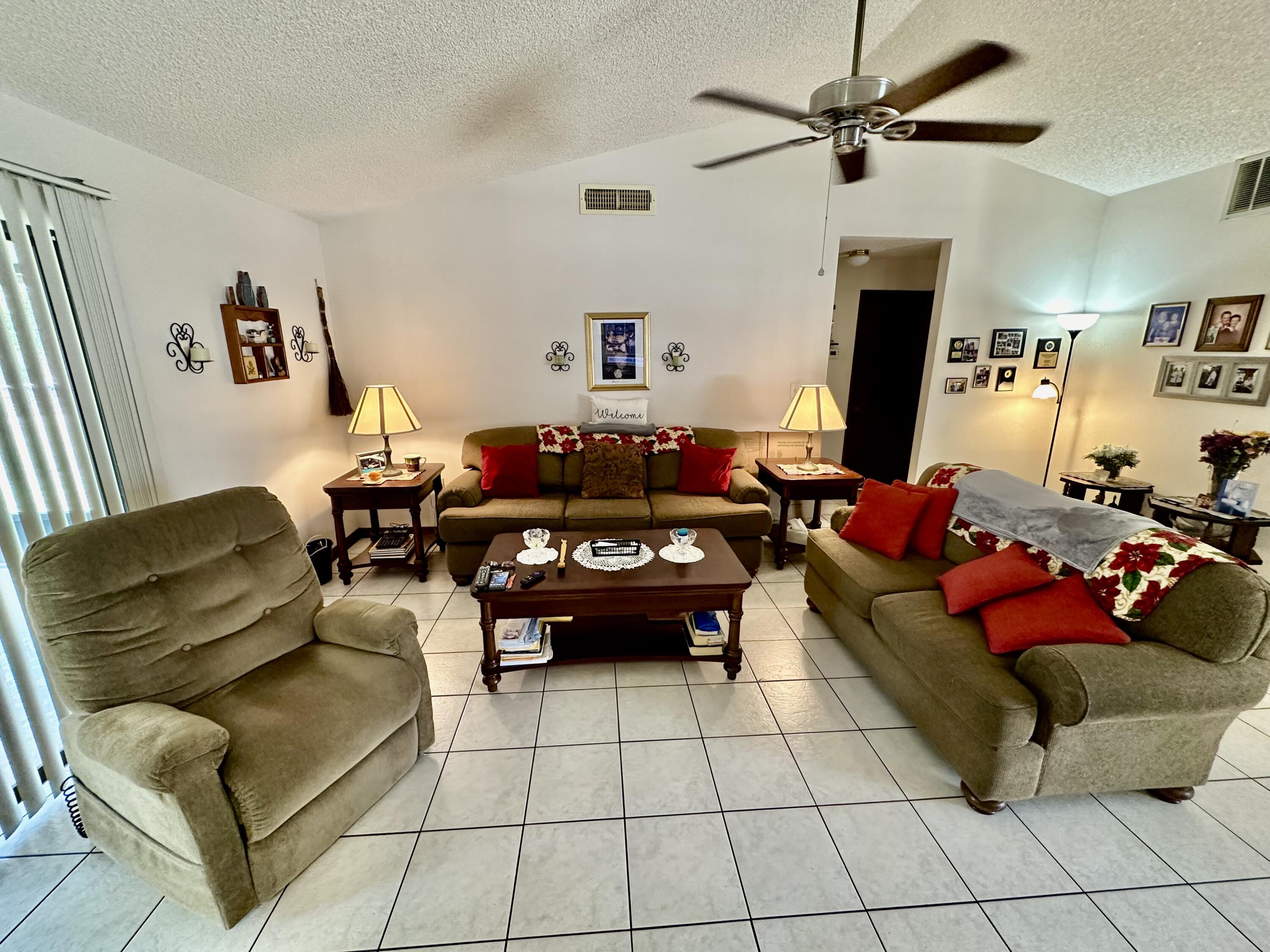4980 Bridge Road Cocoa, FL 32927 - Photo 8 of 24 a living room with furniture and a flat screen tv