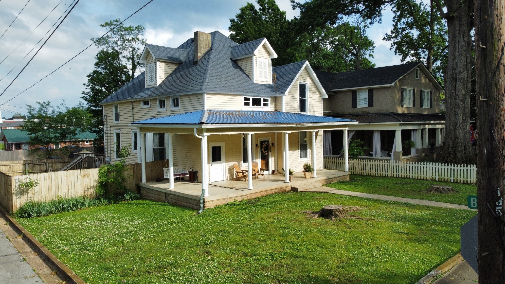 a front view of a house with a yard table and chairs