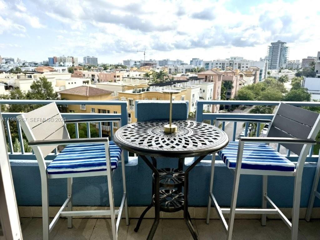 90 Alton Road, Unit 803 Miami Beach, FL 33139 - Photo 13 of 23 a view of a chairs and table in the terrace
