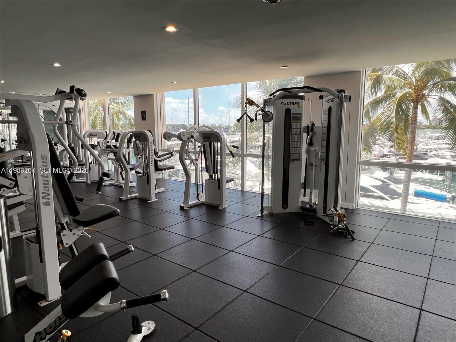 90 Alton Road, Unit 803 Miami Beach, FL 33139 - Photo 19 of 23 a view of a room with gym equipment