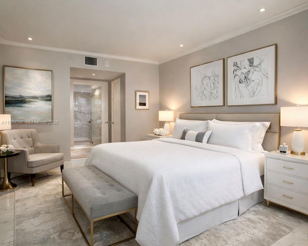 90 Alton Road, Unit 803 Miami Beach, FL 33139 - Photo 5 of 23 a spacious bedroom with a bed and a couch